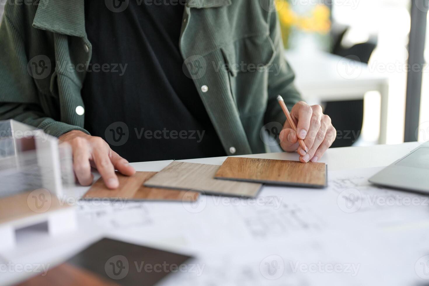 Architecture interior is working on a project with some wood samples photo