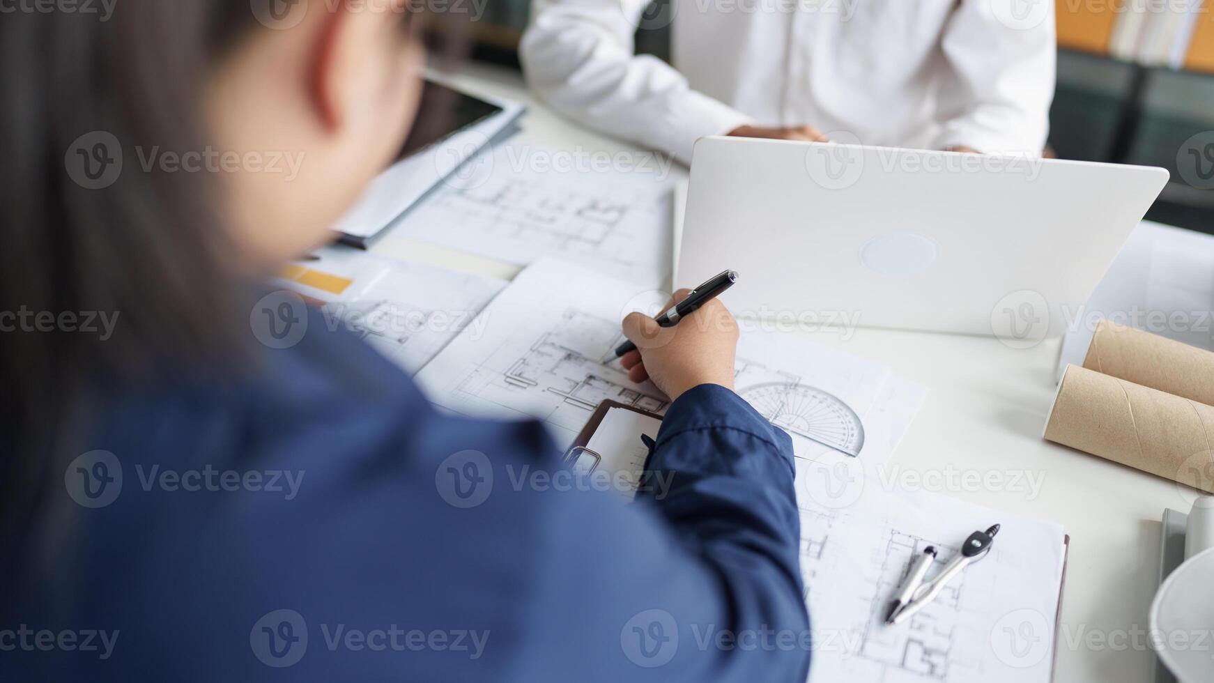 Architecture drawing on architectural project business architecture building construction Colleagues designer Planning Design on blueprint. photo