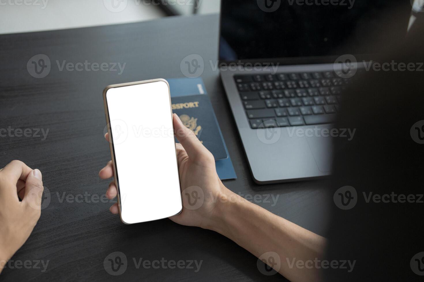 Man hand Online booking and buying plane tickets using laptop phone and credit card Planning trip travel vacation with passport and ticket. photo