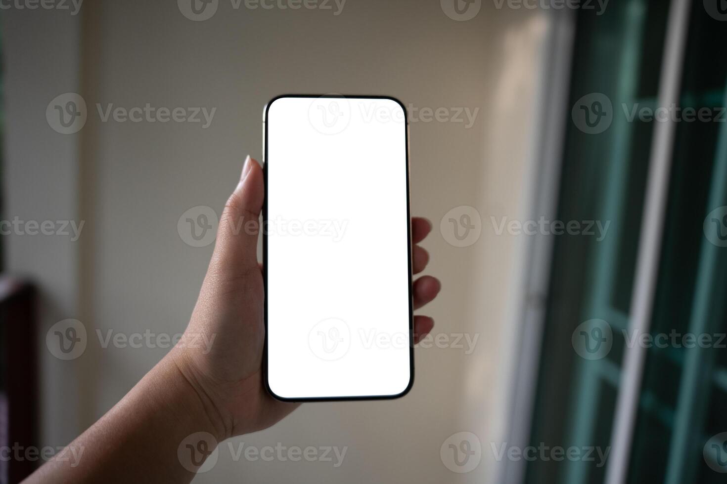 Women hands holding cell telephone blank copy space screen smartphone blank white screen isolated technology concept. Smart phone mockup photo