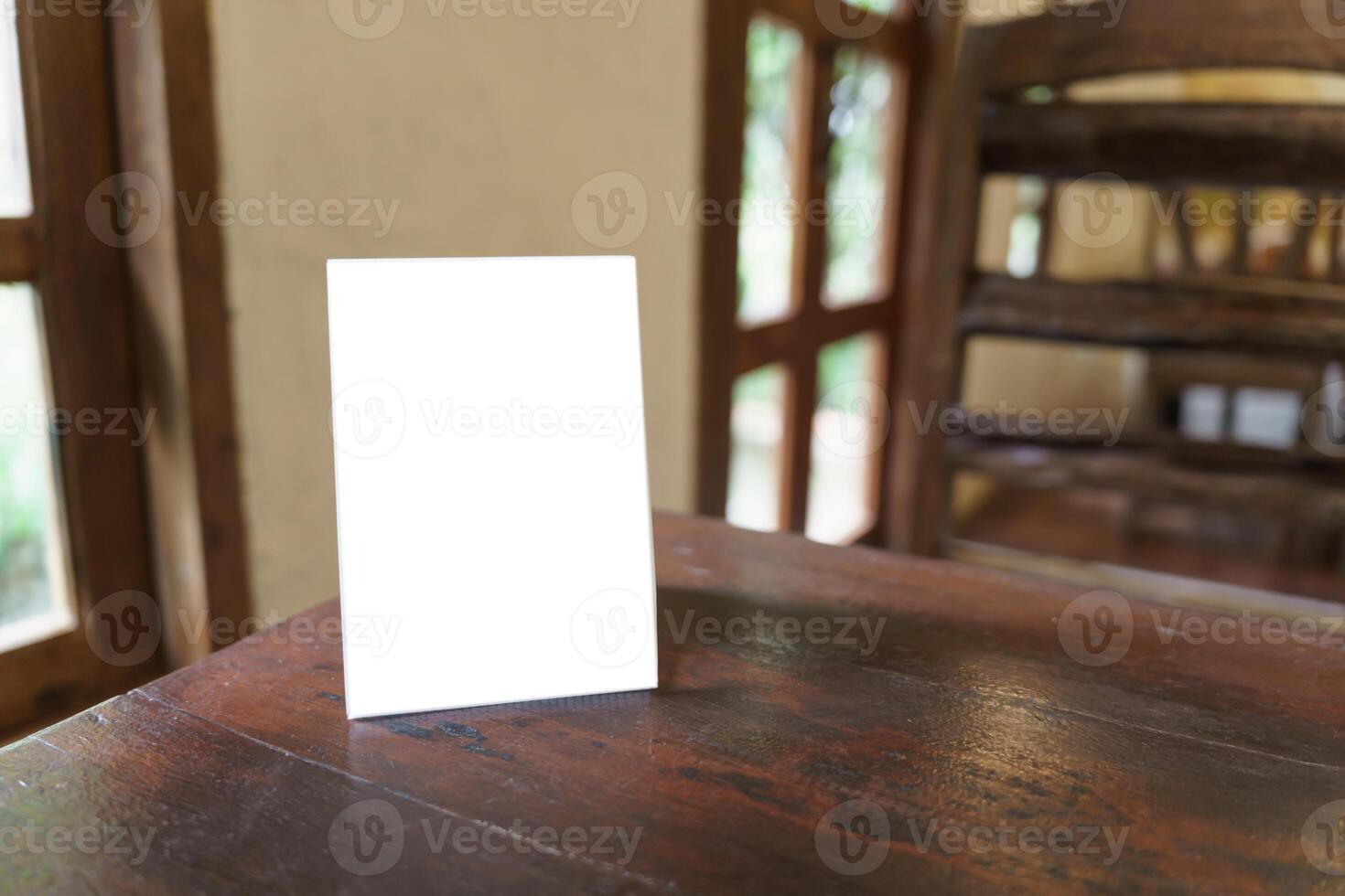 Menu mock up blank for text marketing promotion. Mock up Menu frame standing on wood table in restaurant space for text photo