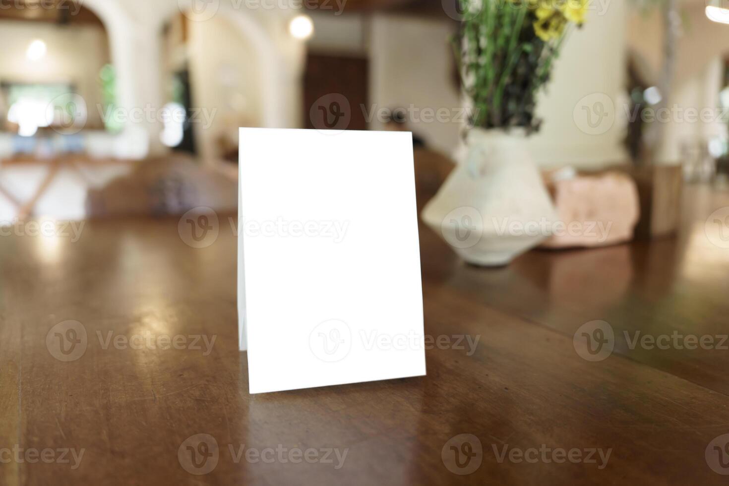 Menu mock up blank for text marketing promotion. Mock up Menu frame standing on wood table in restaurant space for text. photo