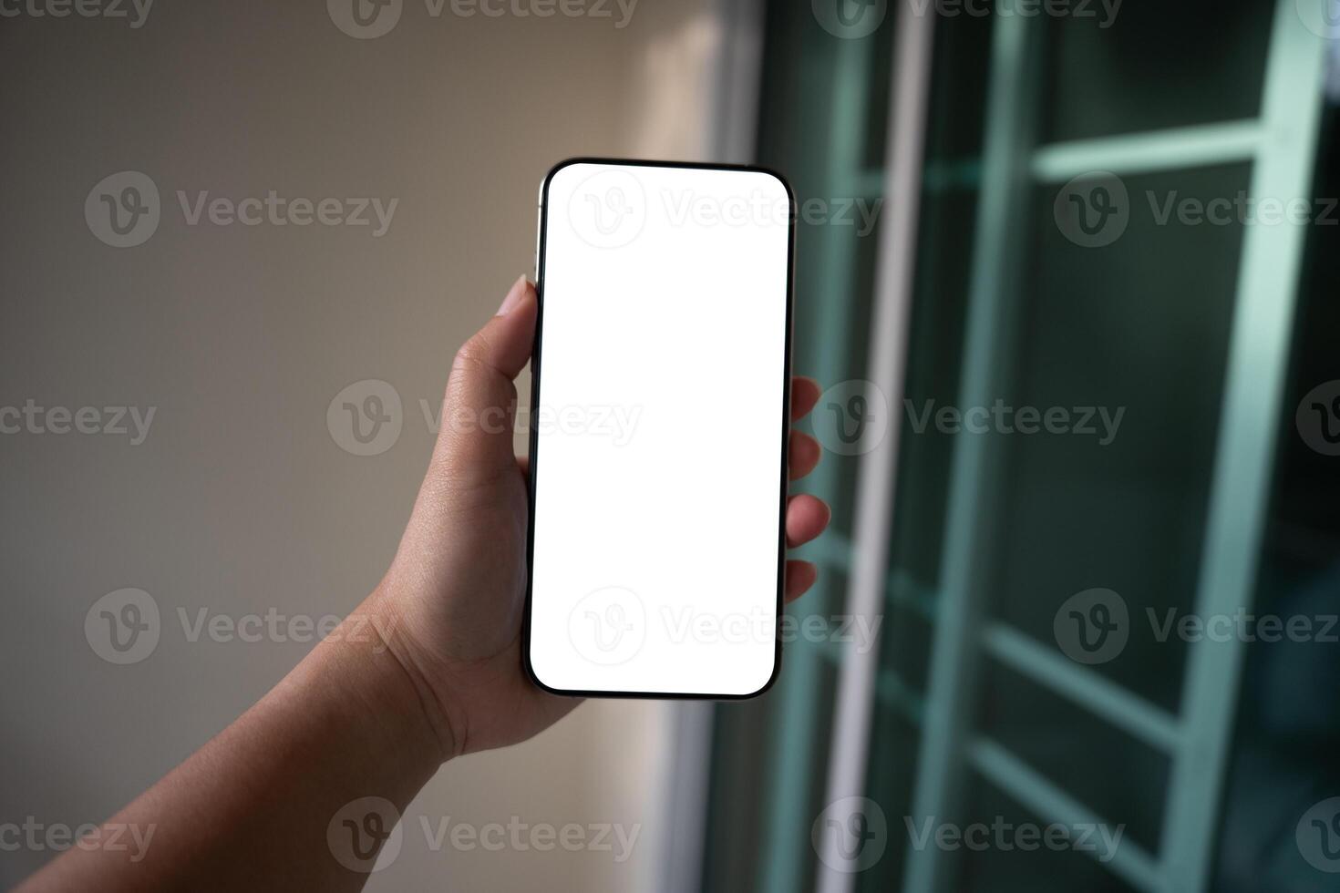 Smart phone mockup. Woman hands holding cell telephone blank copy space screen smartphone blank white screen isolated technology concept. photo