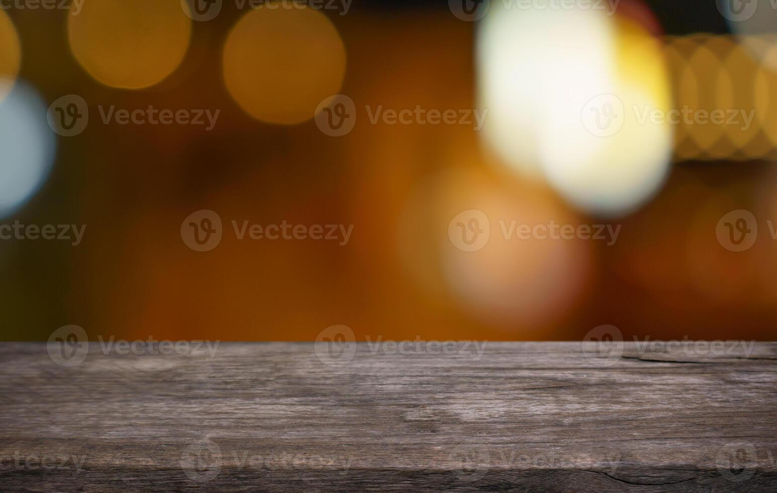wooden table top with blurred bokeh lights. photo