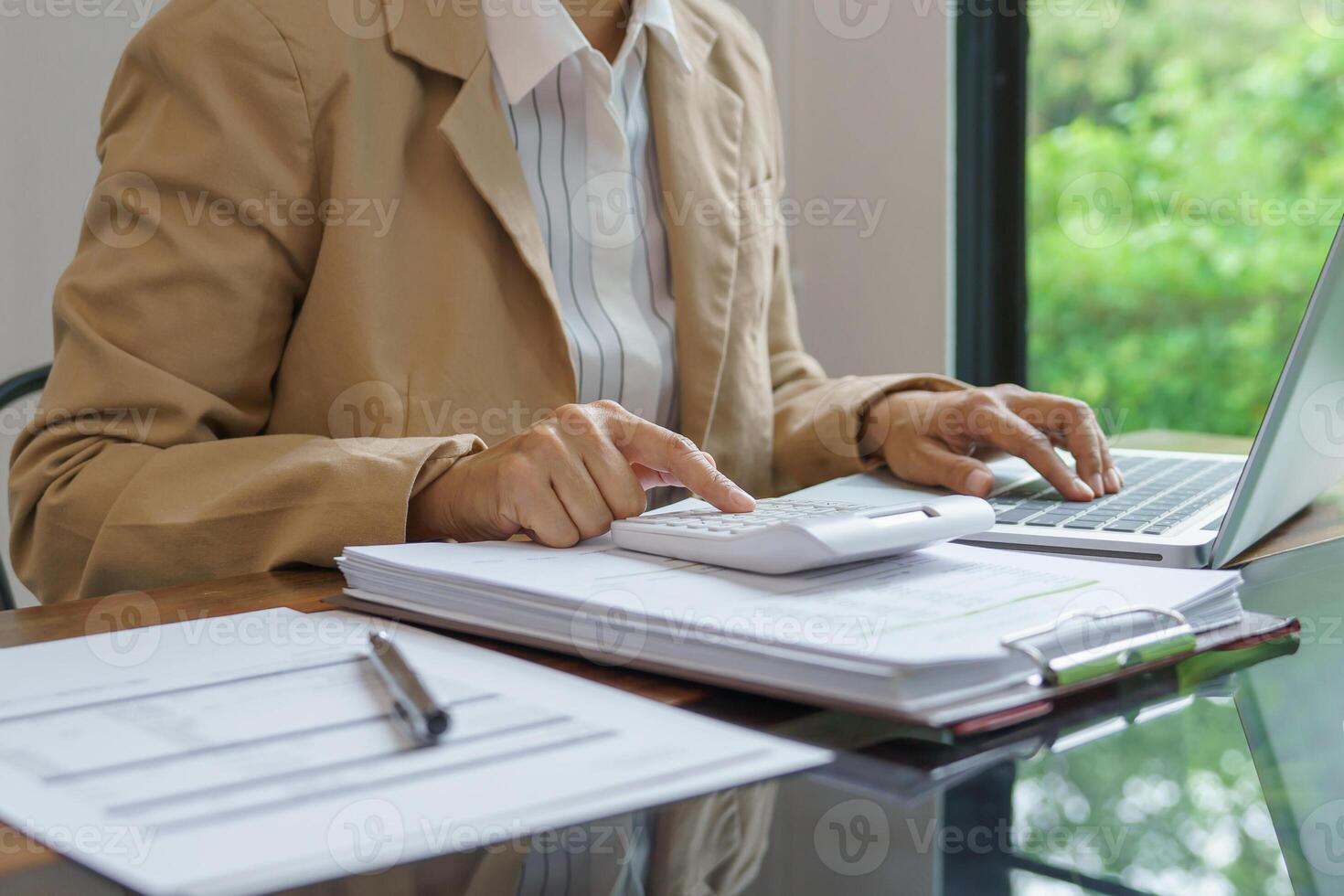 Calculating Cost Economic budget saving and investment concept analyzing investment charts and calculator photo