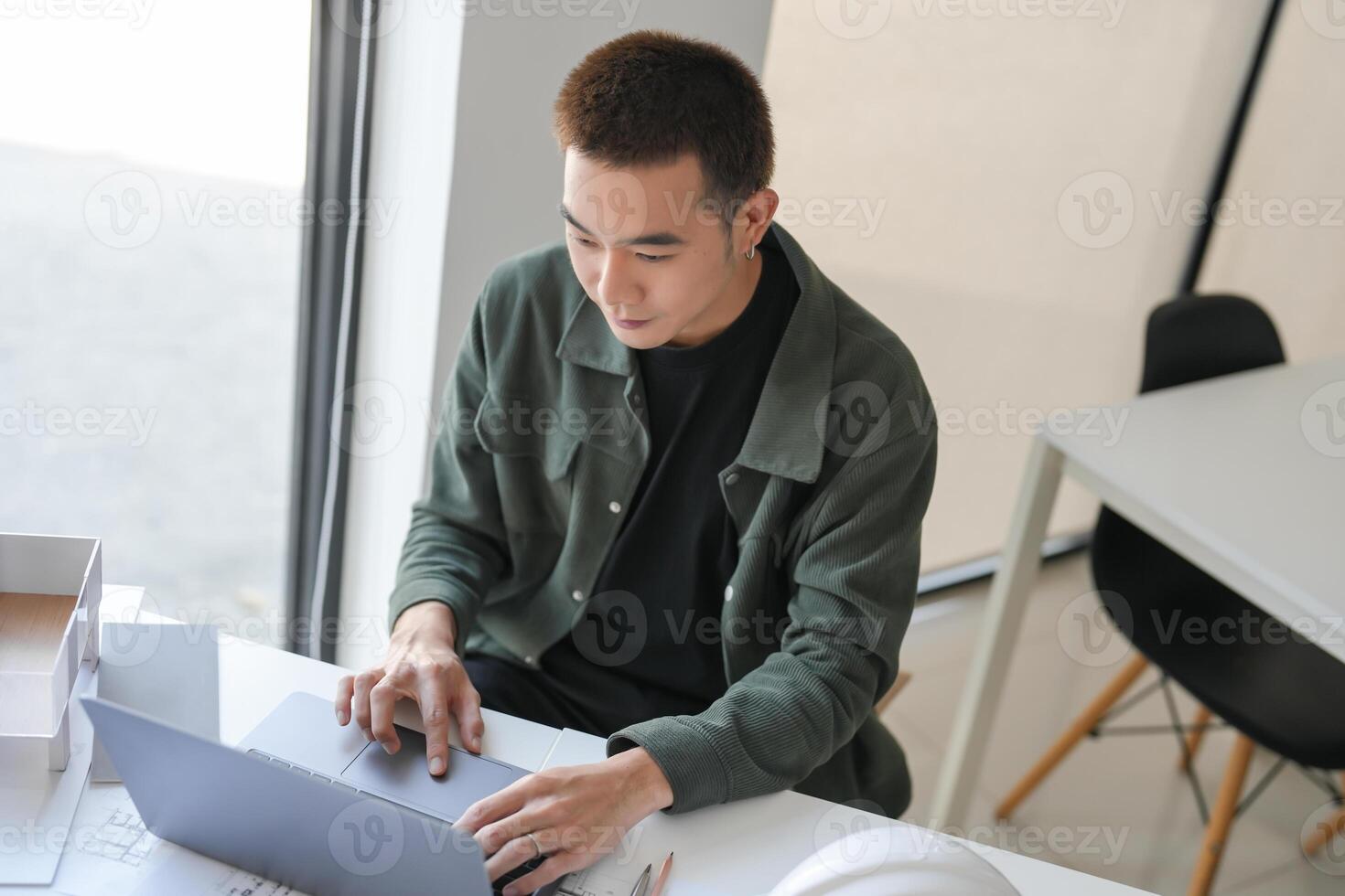 Architecture Man drawing on architectural Creative project business architecture building construction Industrial engineering Achievement Planning Design on laptop photo