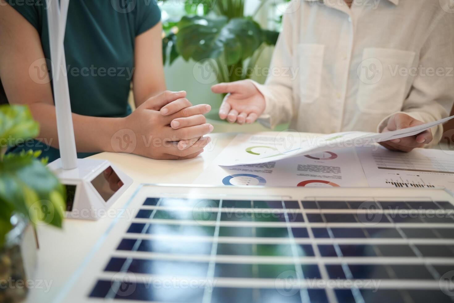 Solar panels green energy Business people working in green eco friendly office business meeting creative ideas for business eco friendly professional teaching sustainable photo