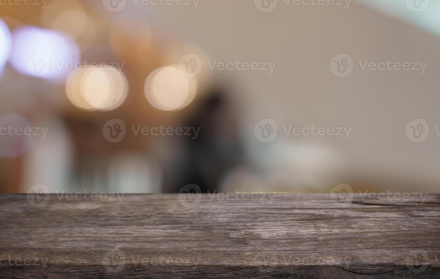 Empty wood table top and blur of restaurant background, selective focus product display. photo