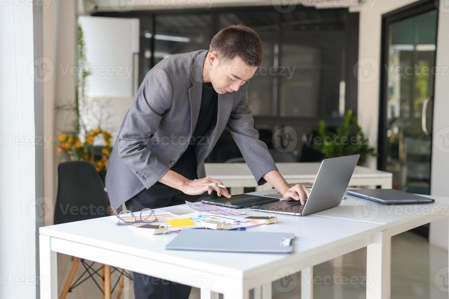 asian Business Man Artist Creative Designer sketch graphic drawing on graphic laptop and Color swatch samples Concept of idea creativity photo
