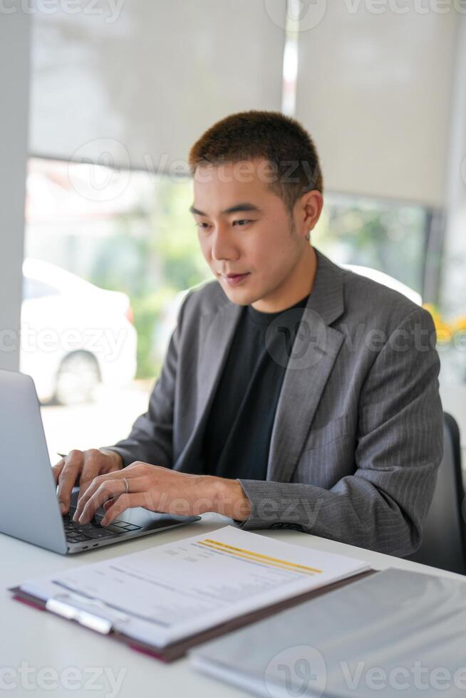 Businessman working using laptop computer Hands typing keyboard. Professional investor working start up project. business planning in office. Technology business photo