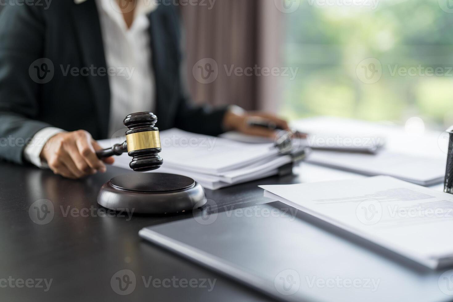 a judge's gavel on a desk in a courtroom photo