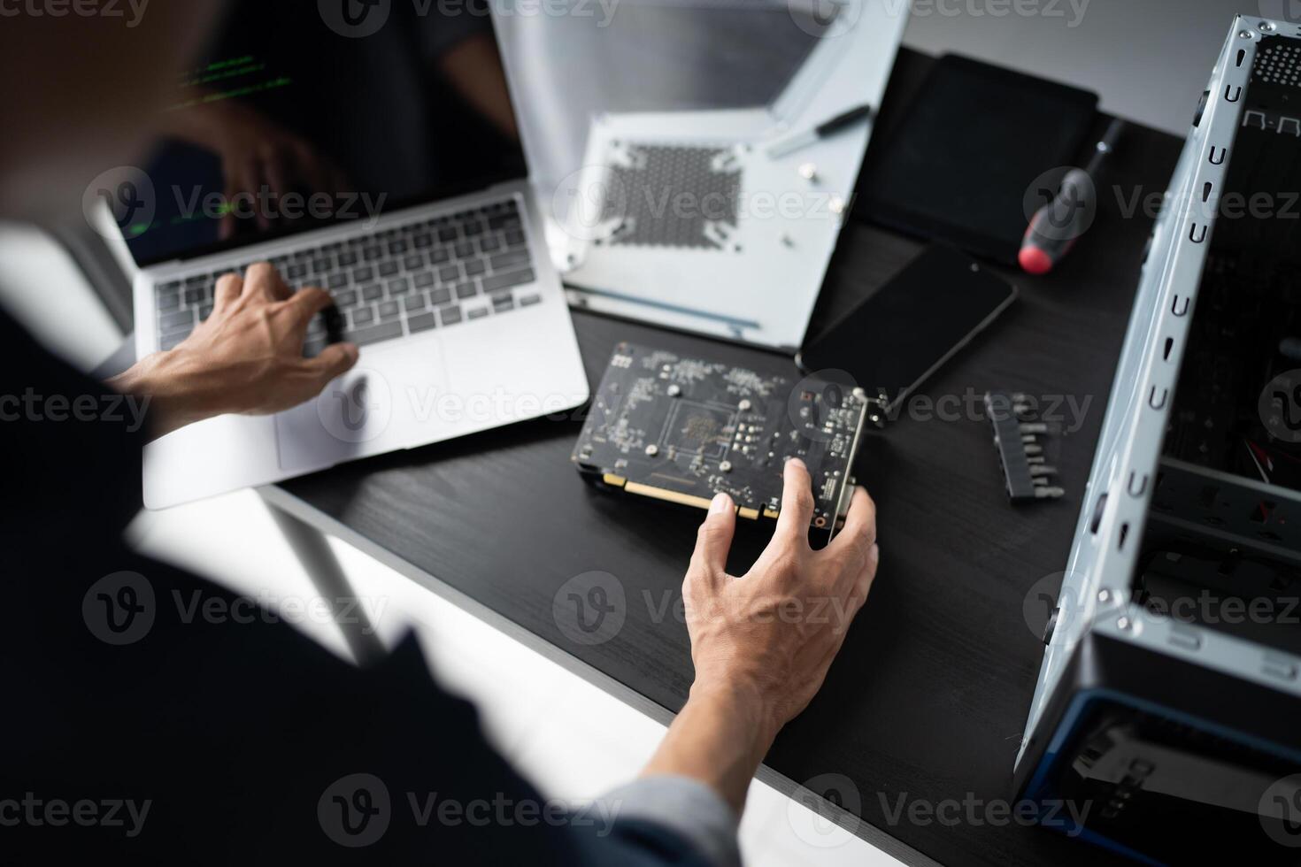 a person is working on a computer with a motherboard photo