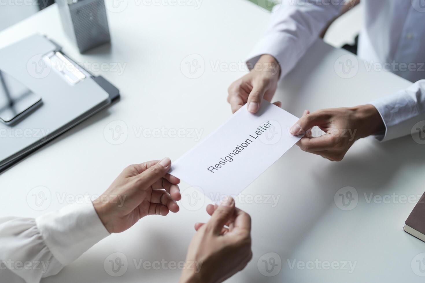 Business man sending resignation letter to boss and Holding Stuff Resign Depress or carrying cardboard box photo