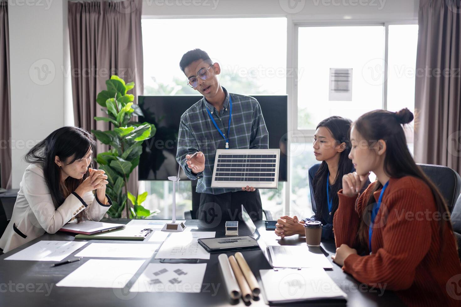 Business people working in green eco friendly office business meeting creative ideas for business eco friendly professional teaching corporate people sustainable electricity. photo
