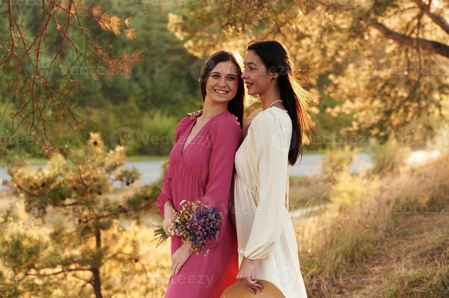 Young ,and happy, having,,, Lovely lesbian couple are together outdoors in nature photo