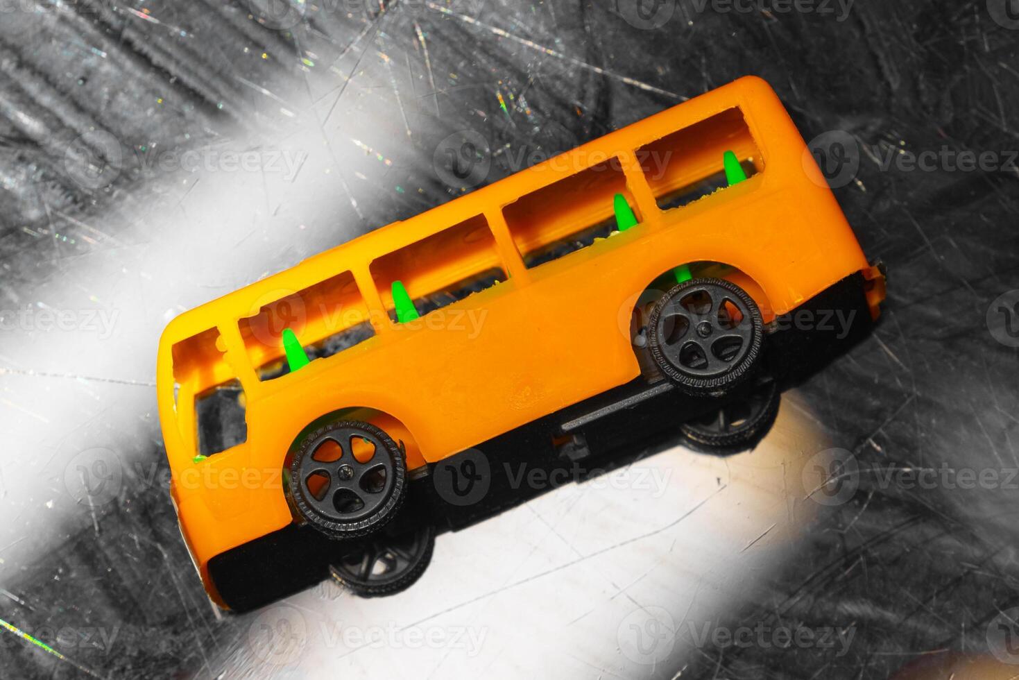 plastic model of a yellow school bus, showcasing a nostalgic representation of childhood and transportation. yellow school bus plastic toy model photo
