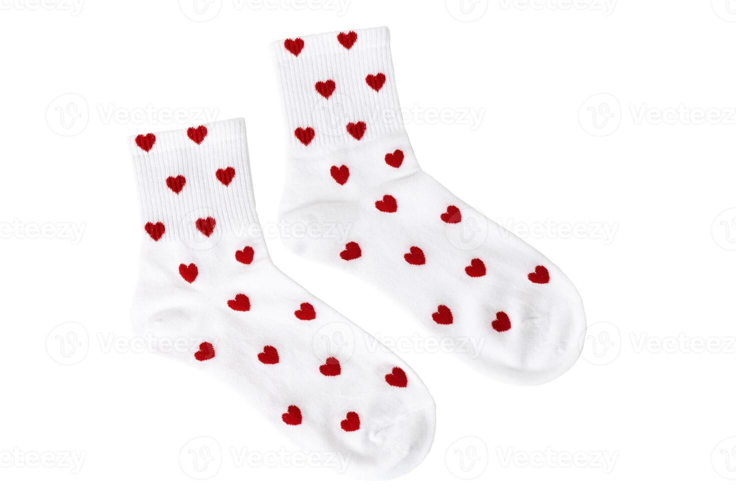 White socks with red heart patterns on white background photo