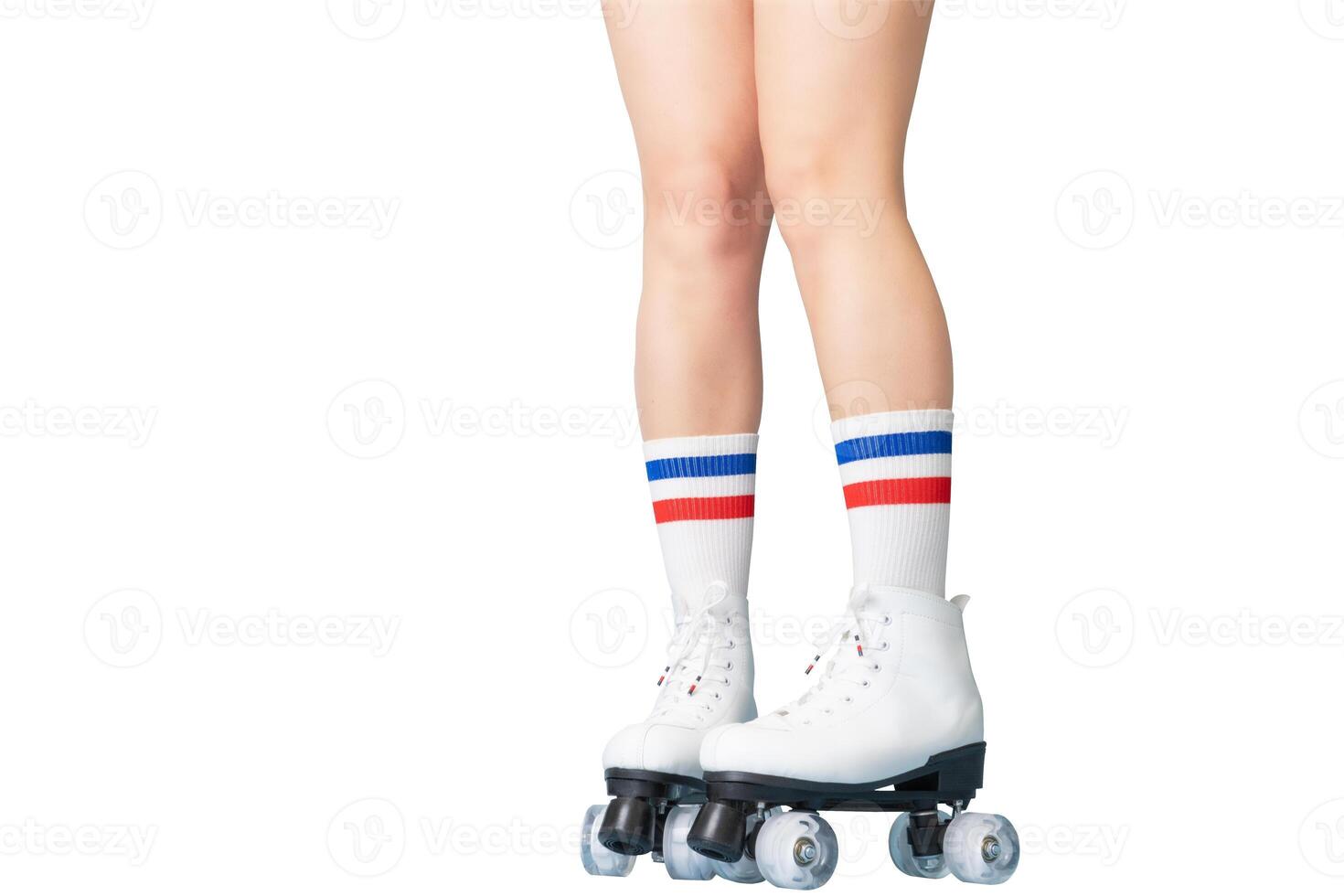 Vintage roller skating with white boots and striped socks on female legs photo