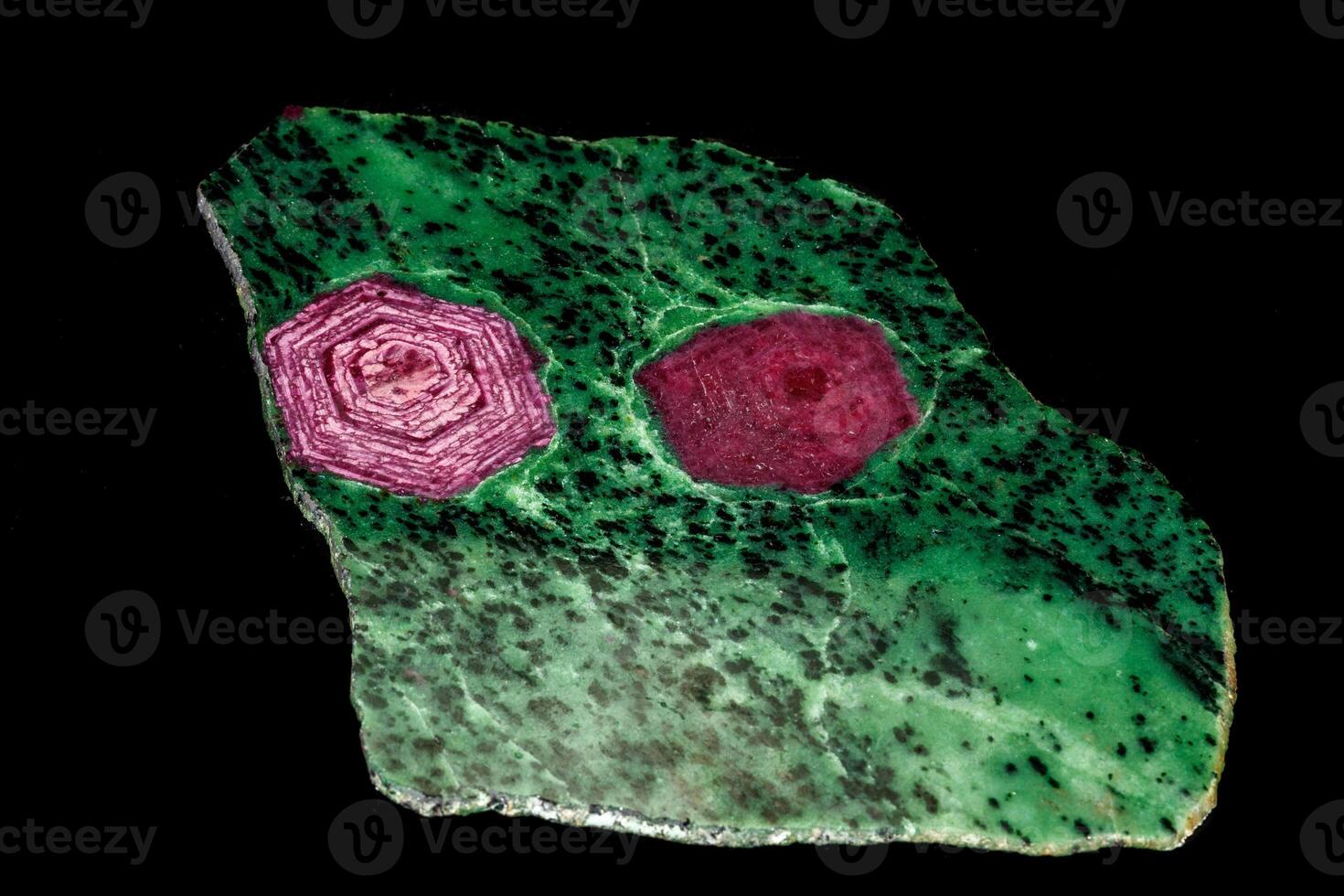 Macro of mineral, stone ruby in rock on black background photo