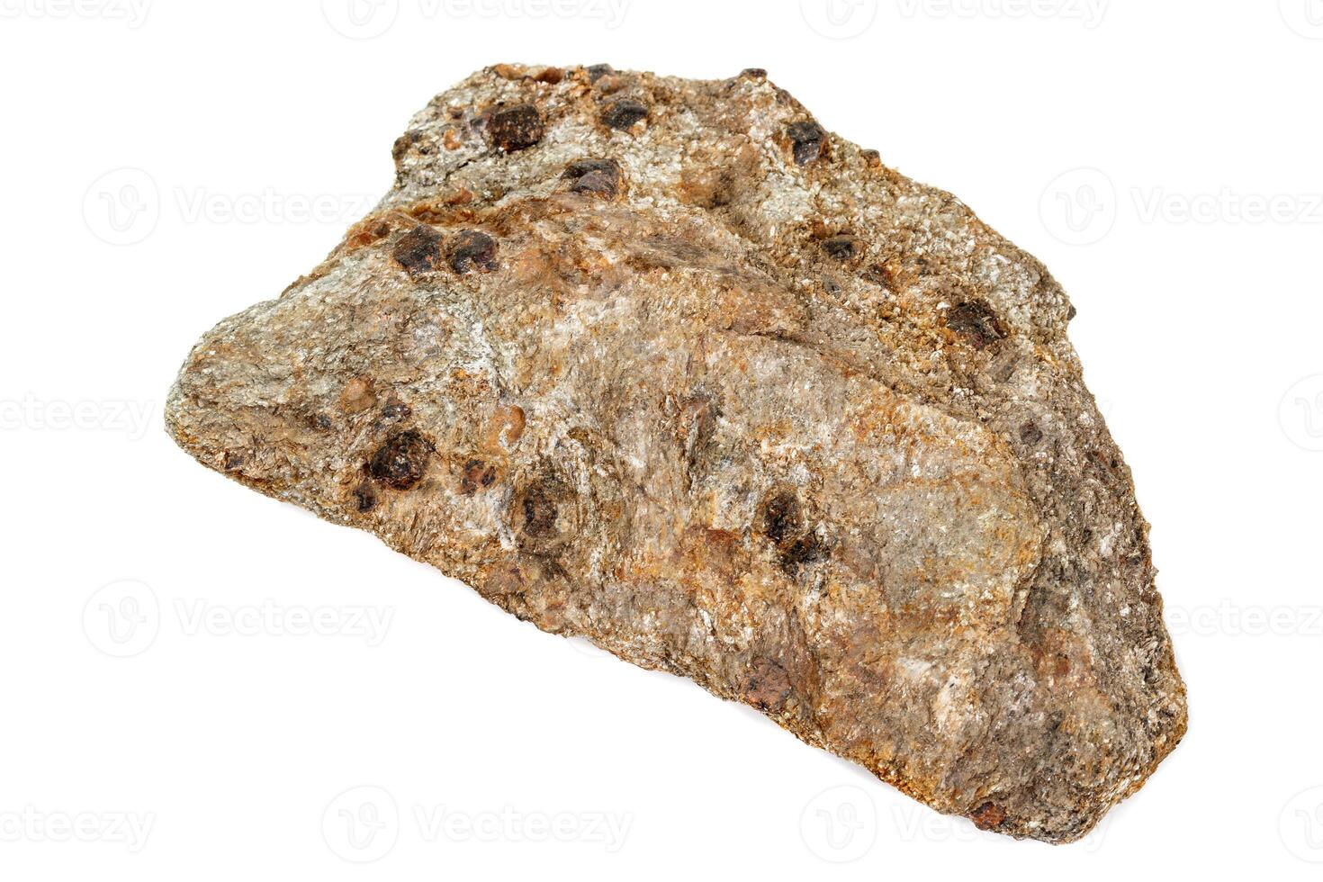 Macro stone, Garnet mineral, in rock on a white background photo