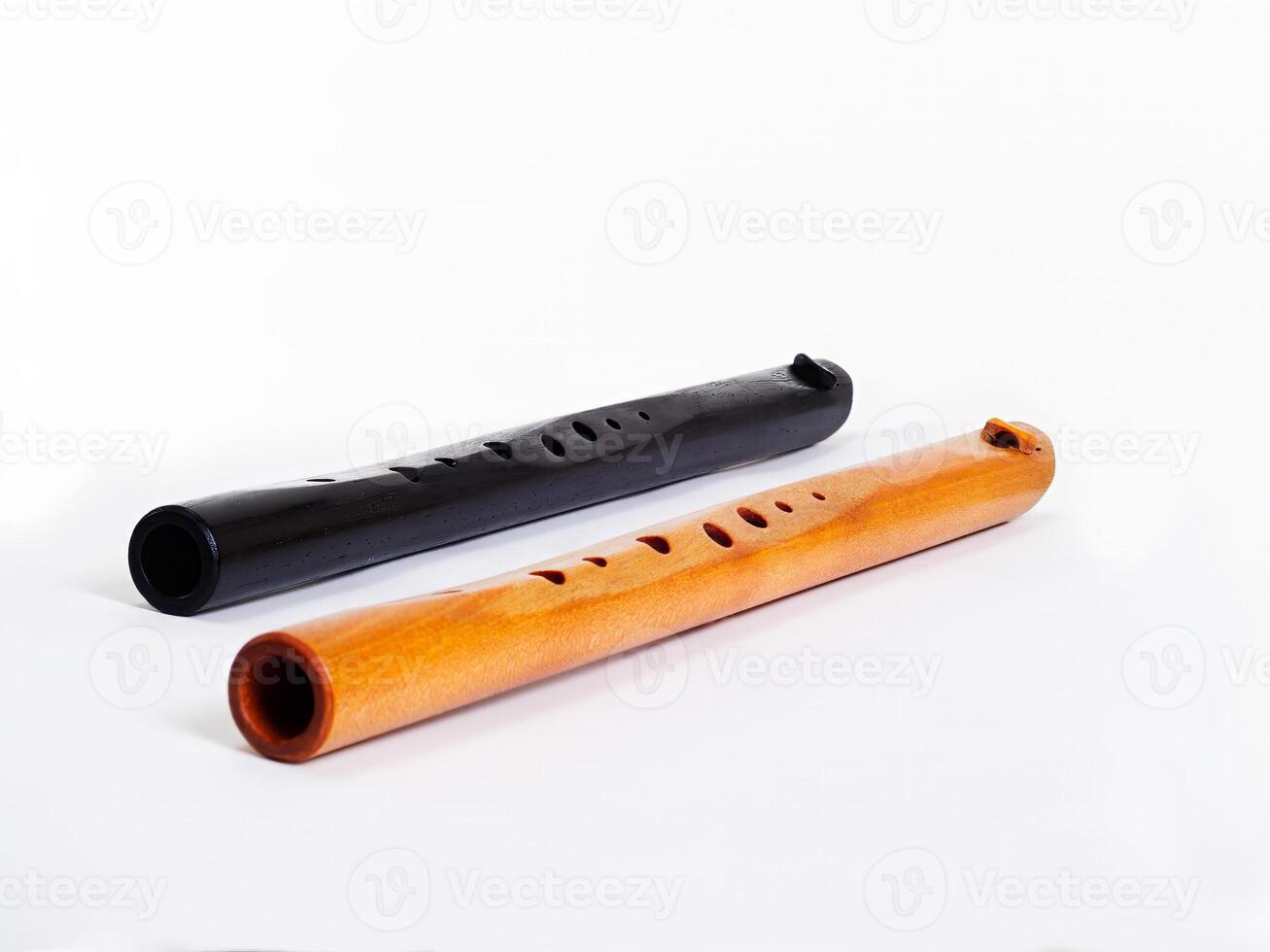 Two Wooden C Flutes On White Background photo