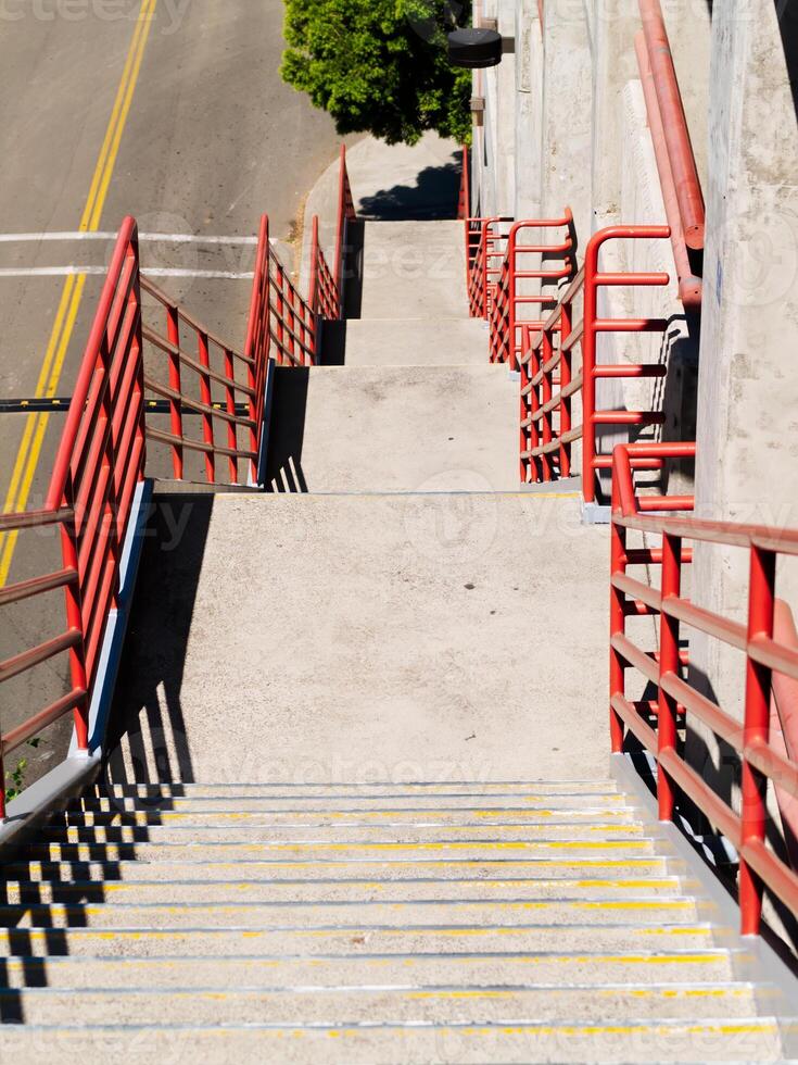 Looking Down On Outdoors Cement Stairs On Parking Garage photo