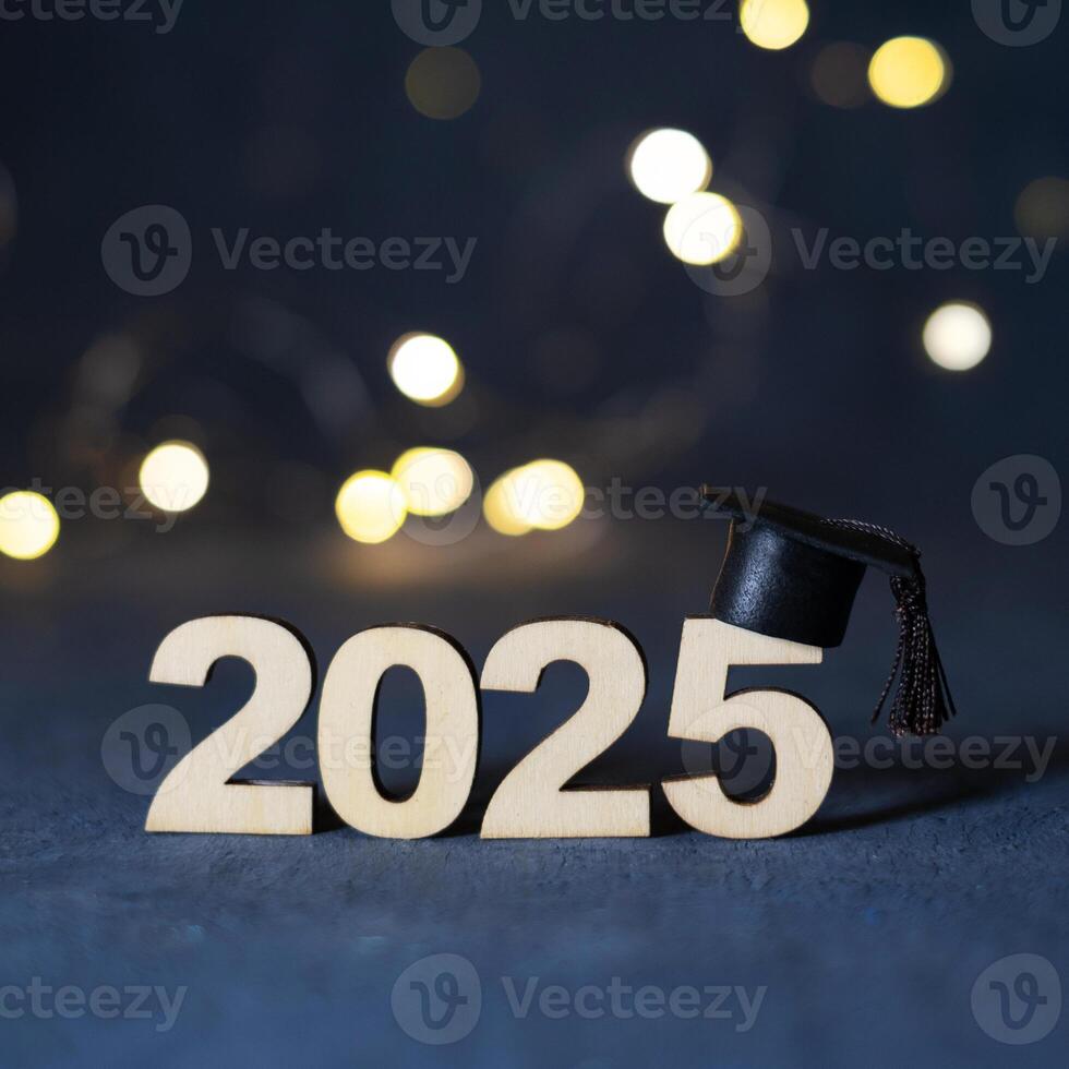 Wooden number 2025 with graduate hat on dark background with bokeh. Class of 2025 concept photo