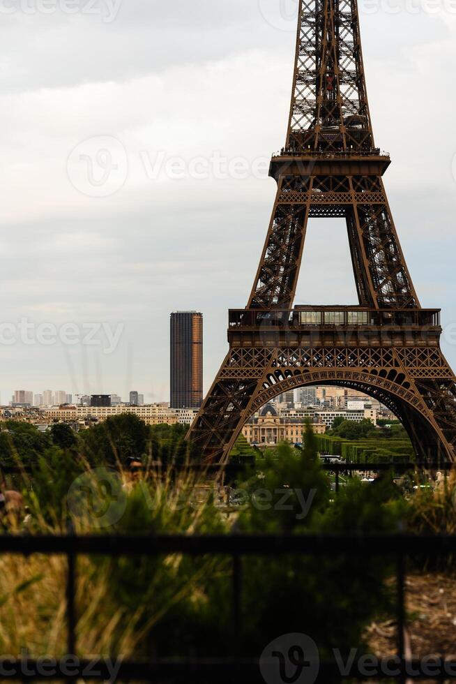 Eiffel Tower Close-Up With Cityscape View photo