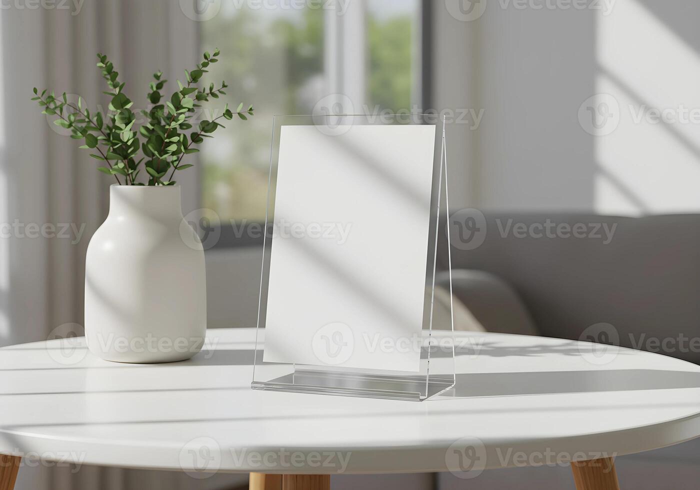 Mockup on Acrylic Stand Displaying a Blank Sheet on a Table 1 photo