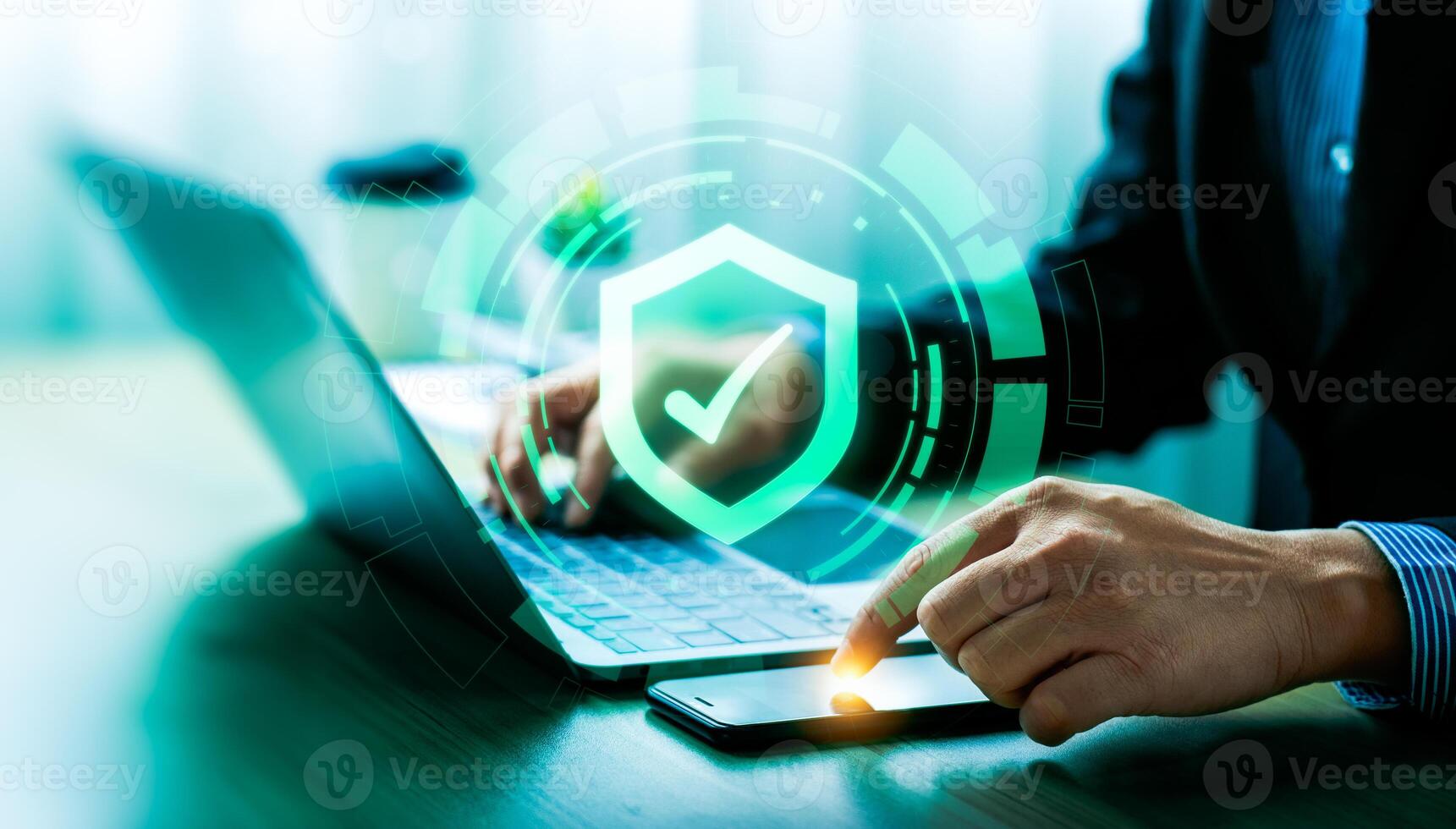 Business cyber defense and information security concept with digital shield icon. Businessman protecting data with multi-device access control, cybersecurity technology, secure authentication system photo