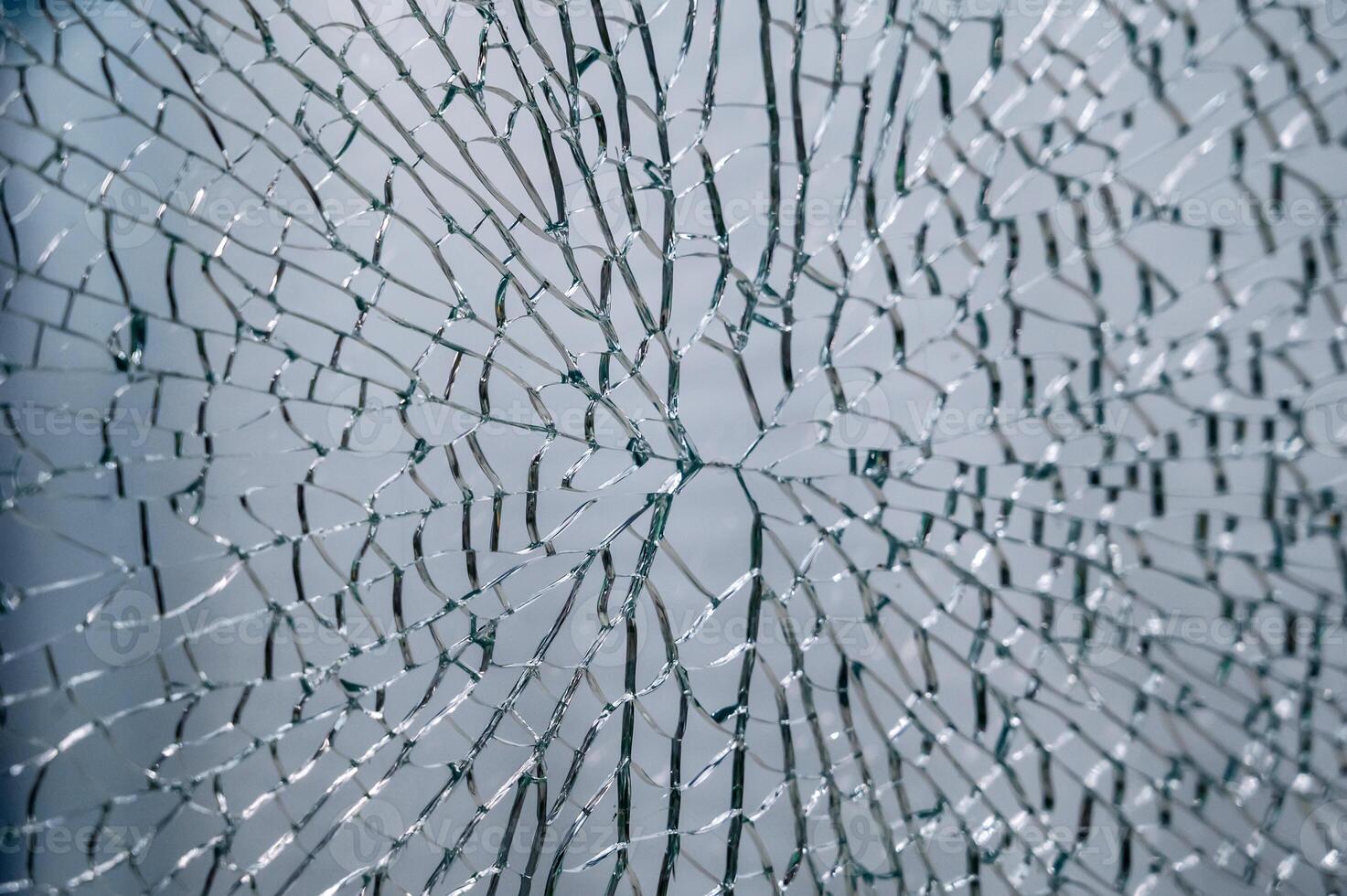 transparent glass, broken into a large number of fragments and parts photo