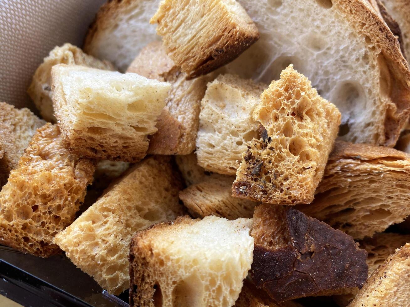 Close up view of delicious crispy golden brown toasted bread croutons perfect for salads and soups photo