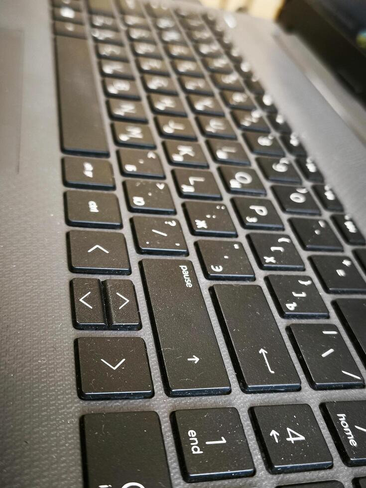 A black keyboard with a few keys missing. The keys that are missing are the enter key and the shift key photo