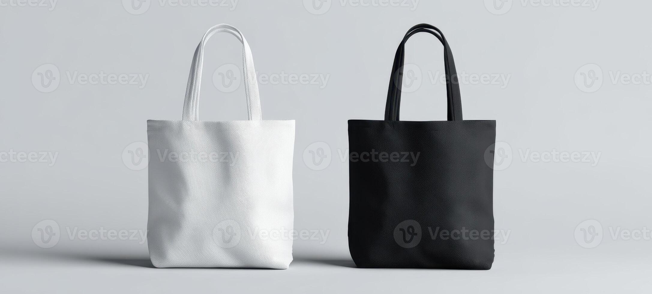 Two black and white tote bags on a gray background photo