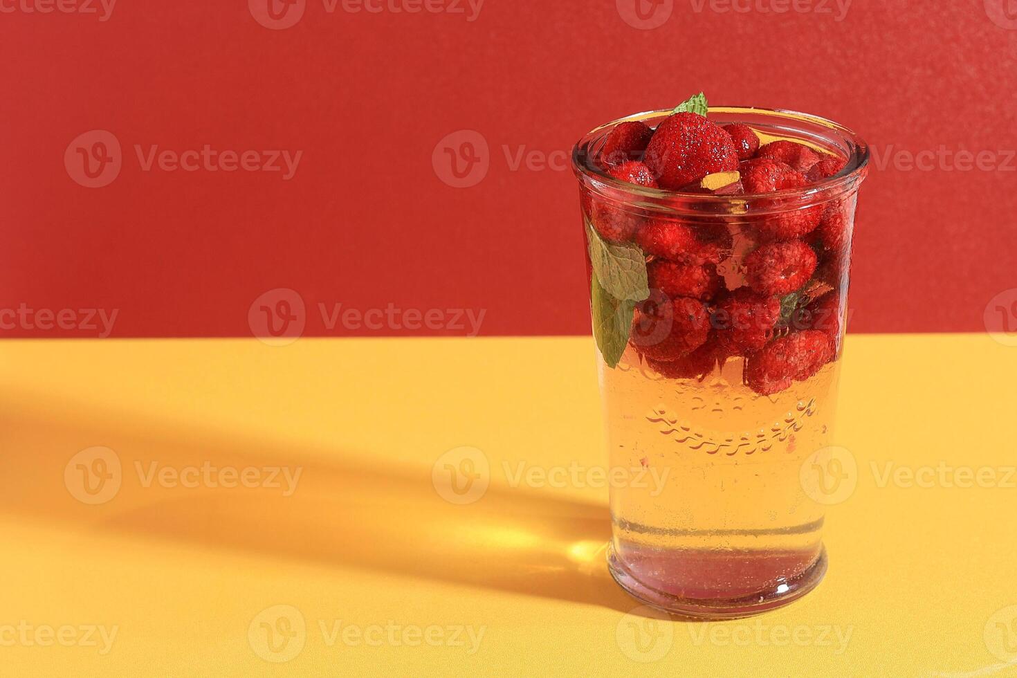 Raspberry Mojito. Refreshing Cool Drink, Lemonade or Ice Berry Tea in a Glass photo