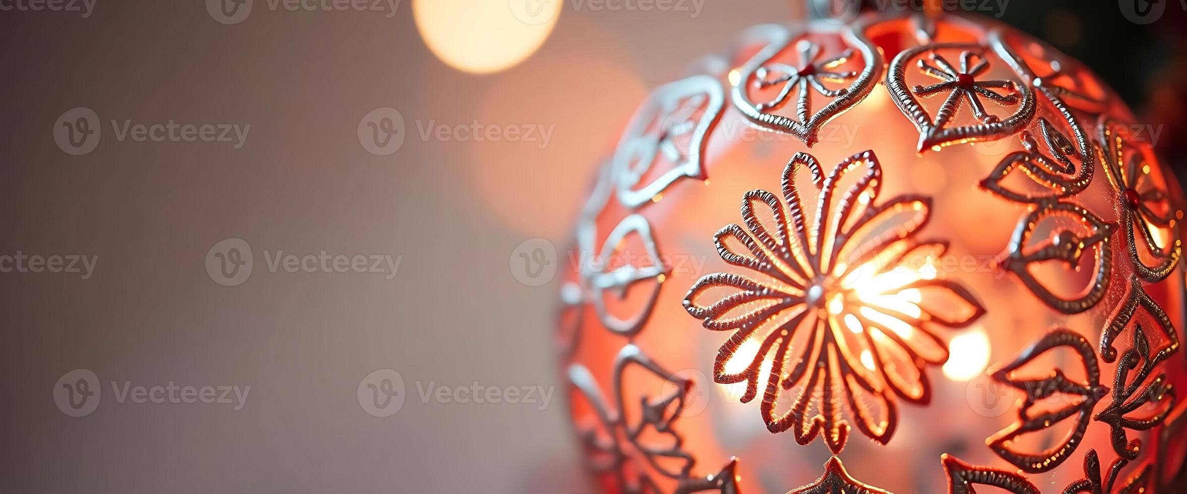 close up of a lit ornament with lights in the background photo
