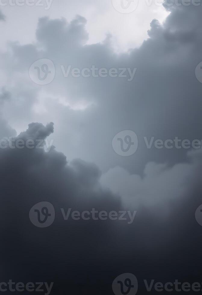 A dark cloudy sky with a few clouds photo