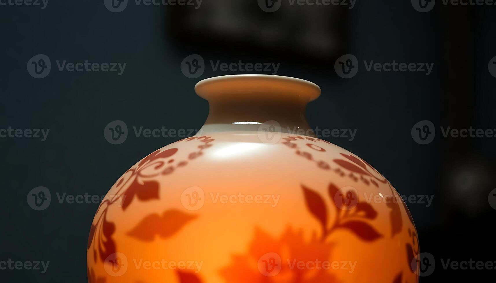 A vase with a candle in it on a table photo