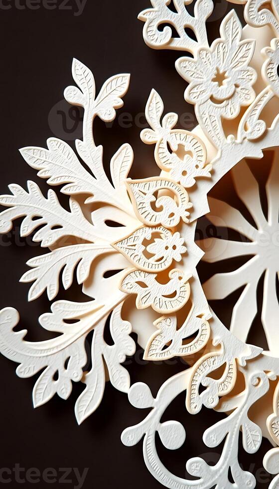 close up of a snowflake on a black surface photo