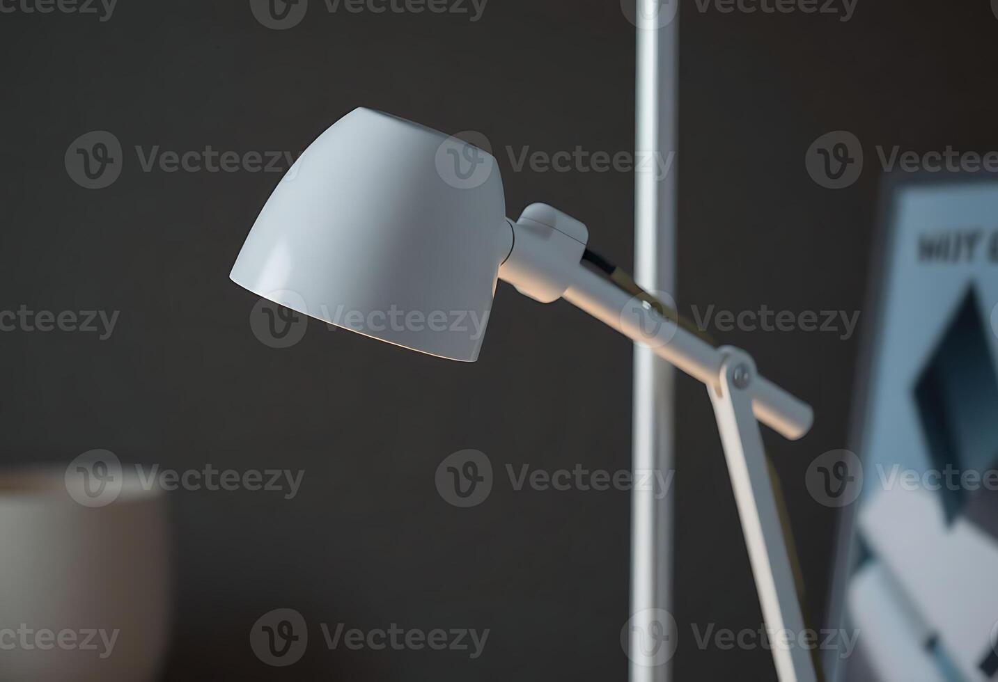 white desk lamp sitting on top of a table photo