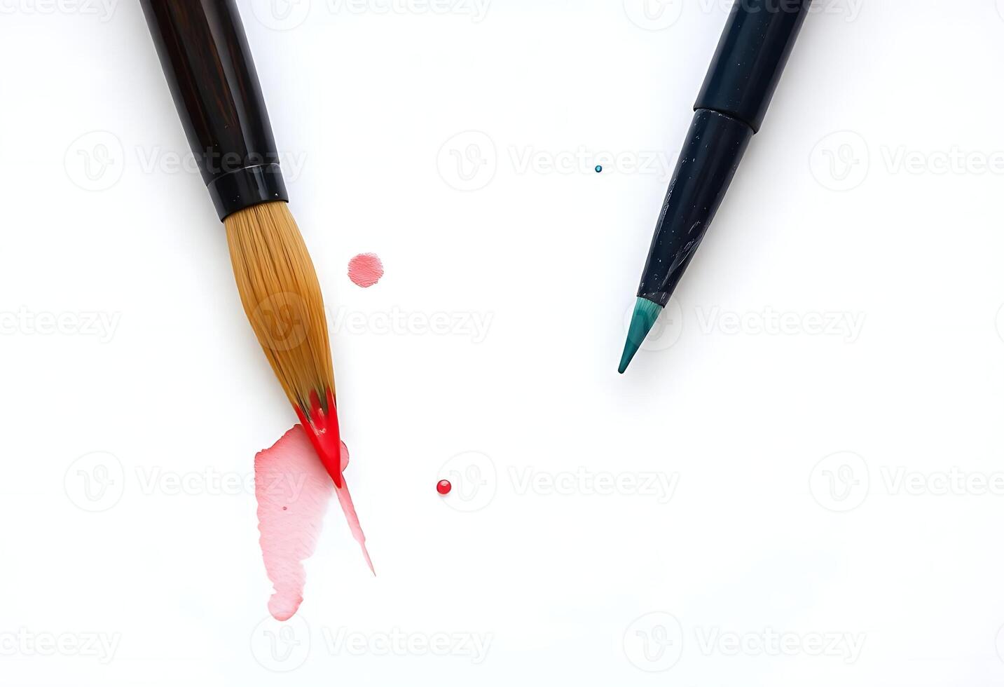 Two paint brushes with red and blue paint on them photo