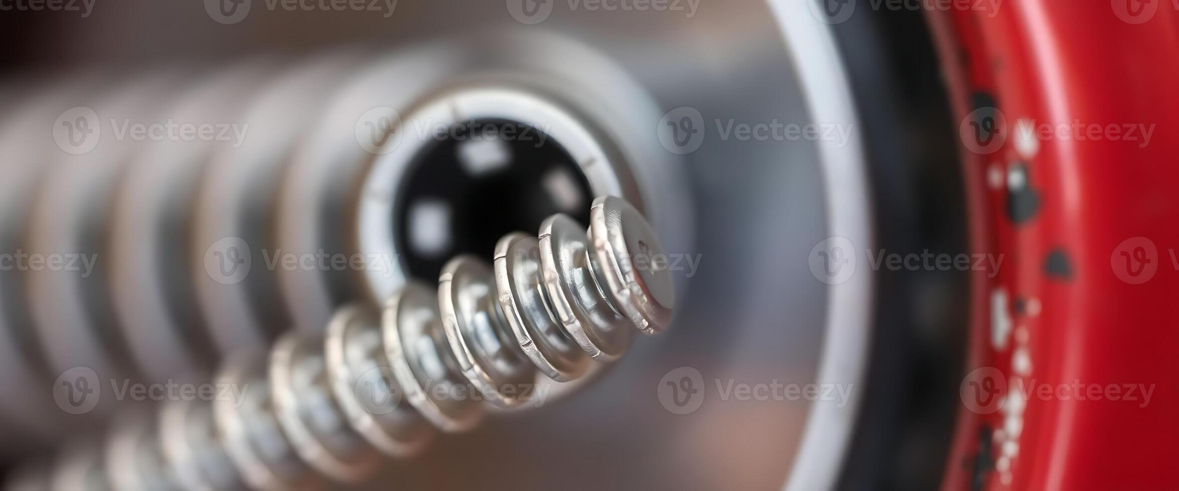 close up of a metal object with a red background photo