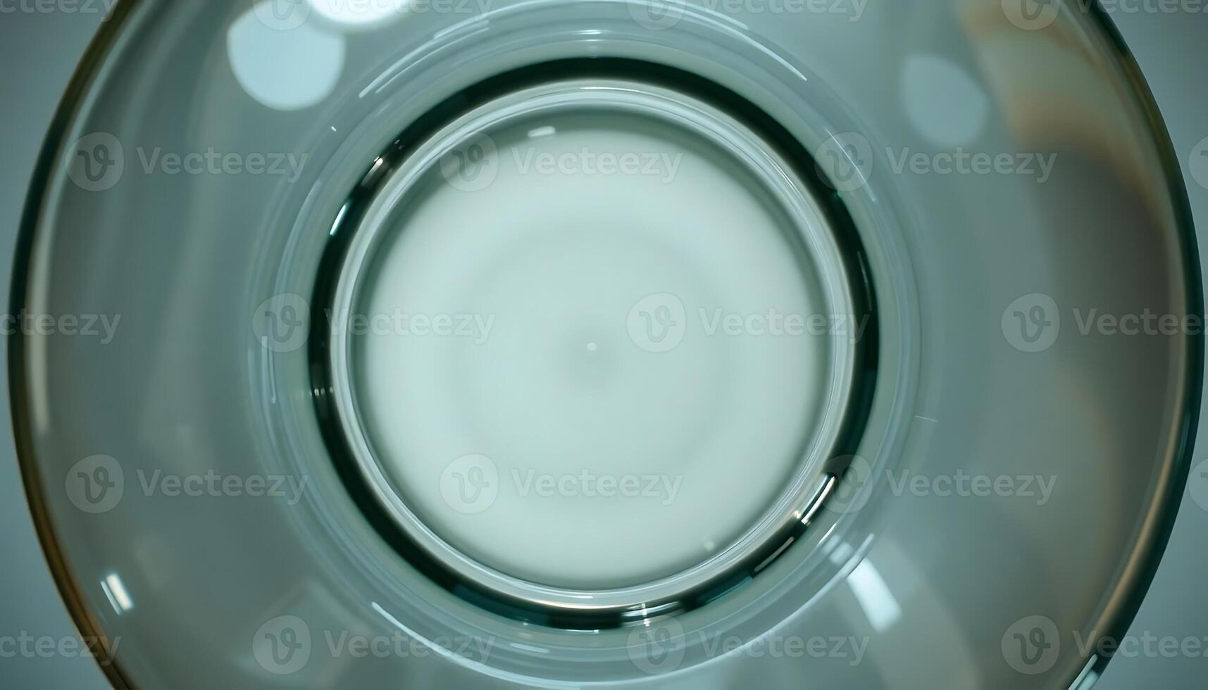 close up of a glass with a liquid inside of it photo