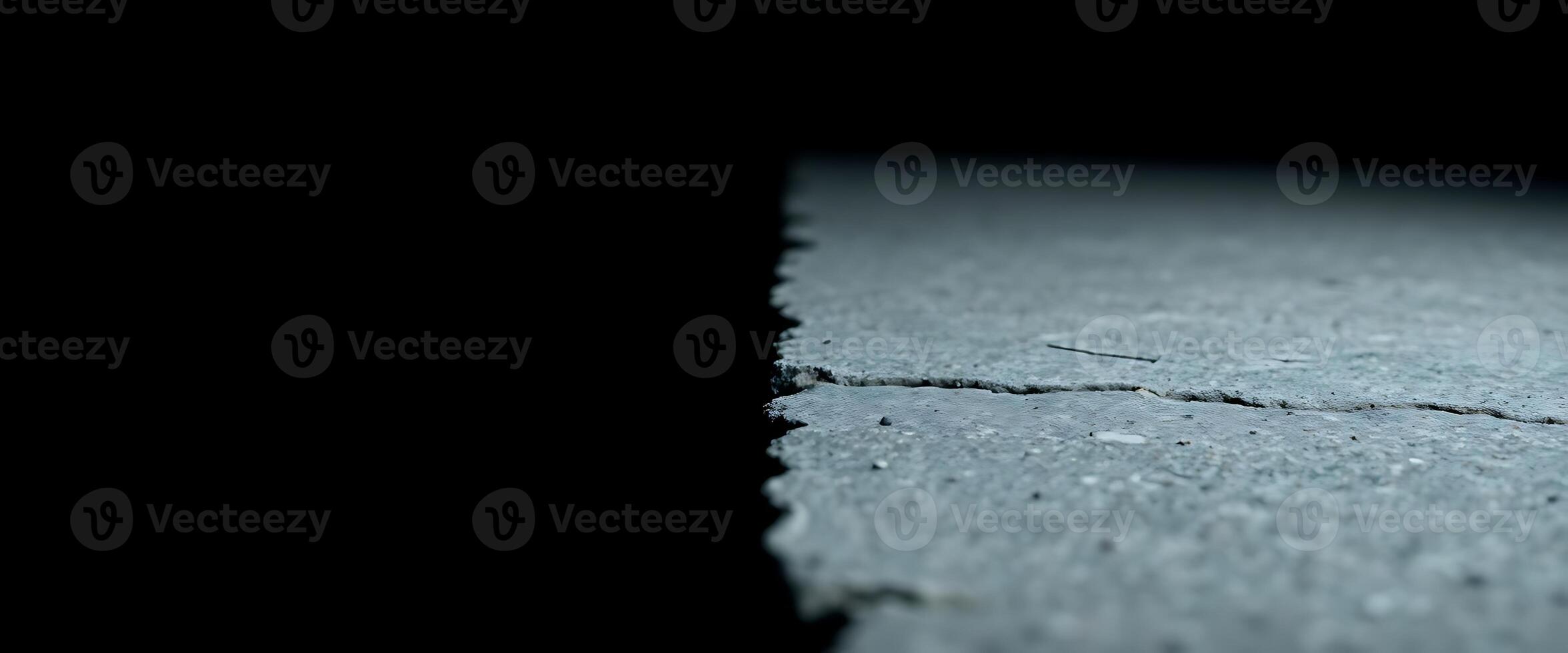 A close up of a crack in the road photo