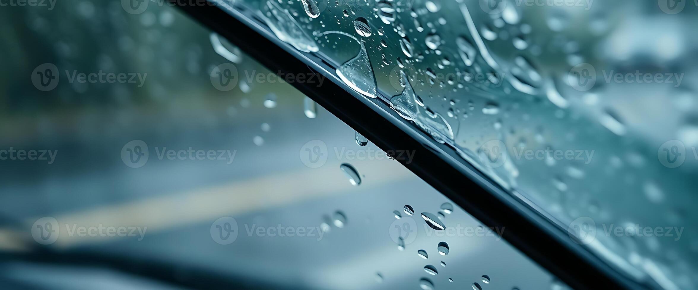 A car windshield with rain drops on it photo