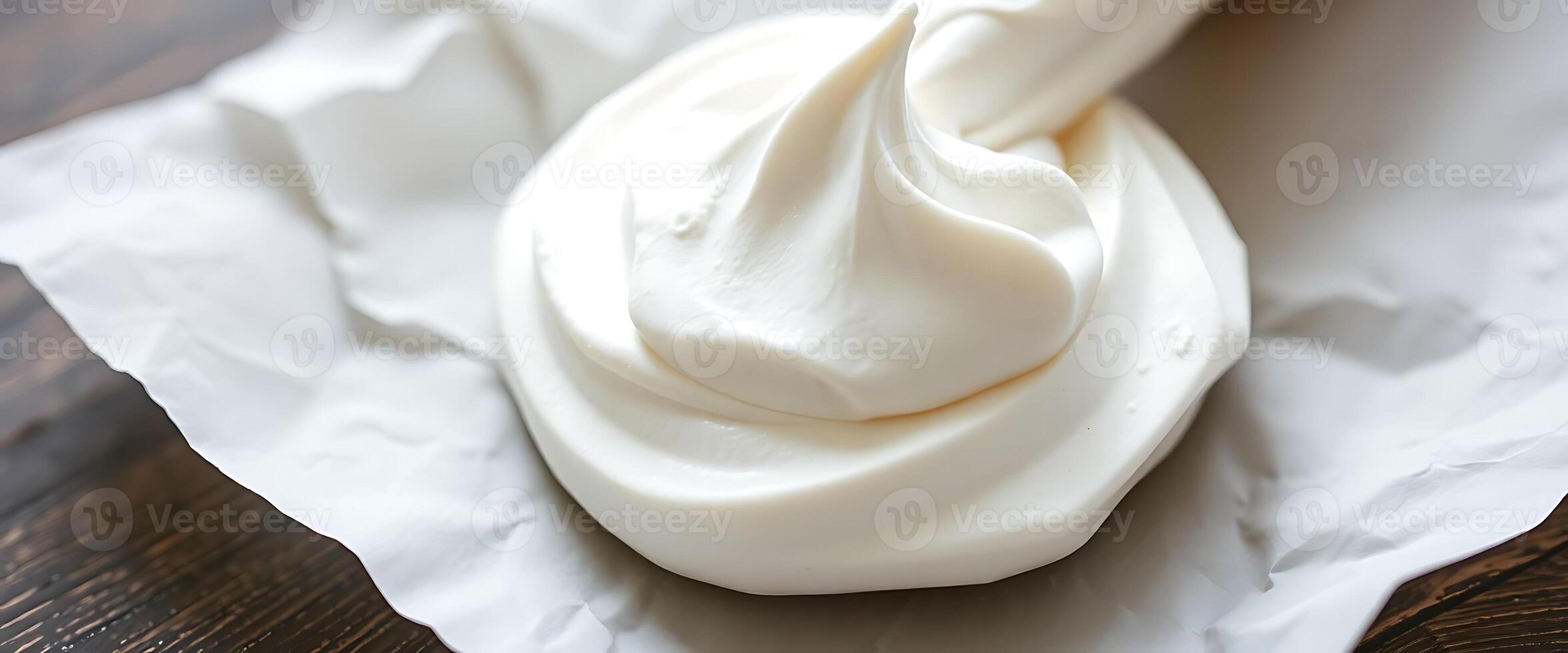 close up of a spoon full of whipped cream photo