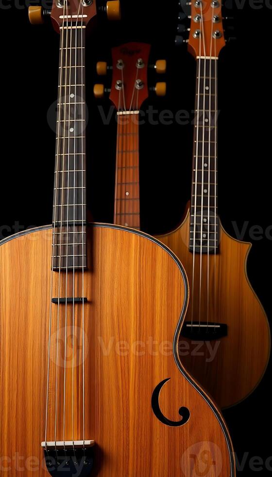 close up of three guitars on a black background photo