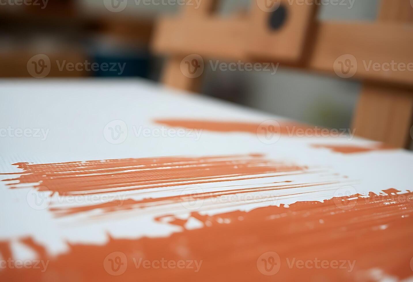 A close up of a painting with orange paint photo