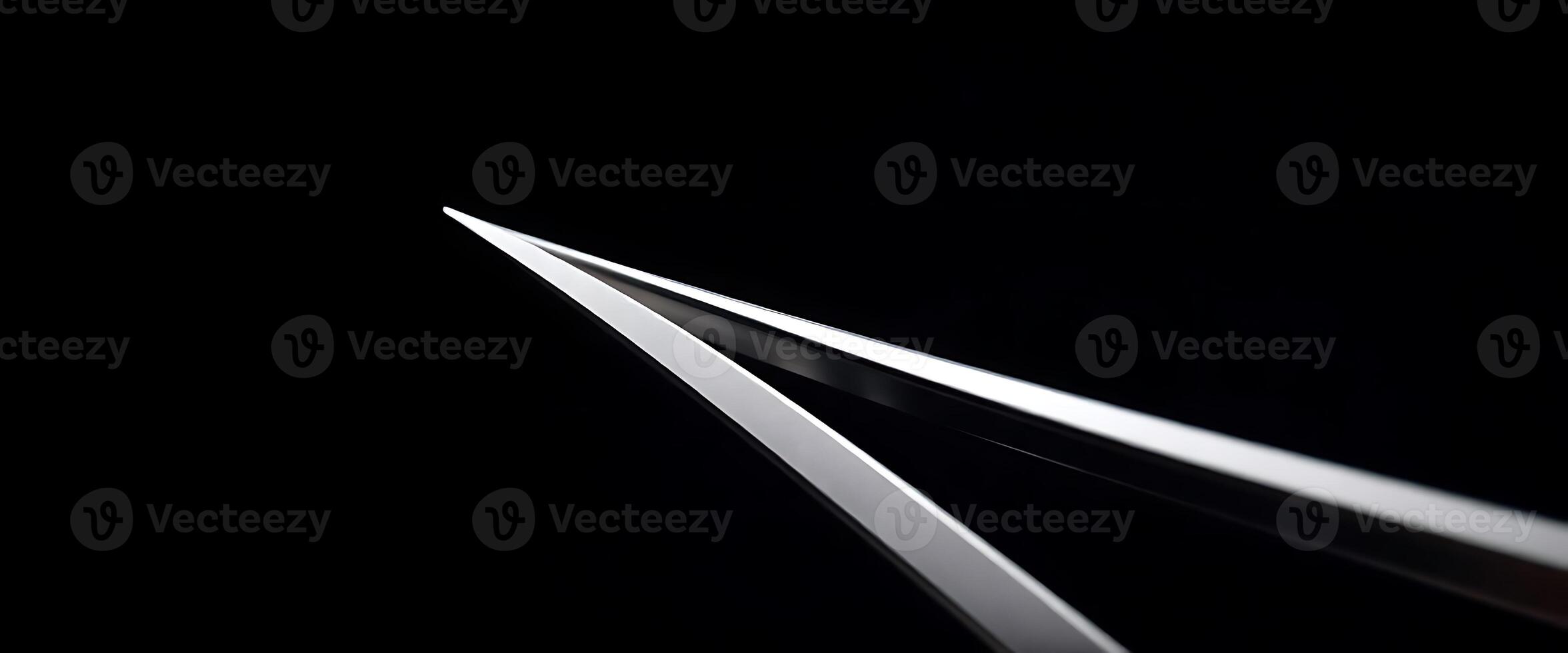 close up of a pair of scissors in the dark photo