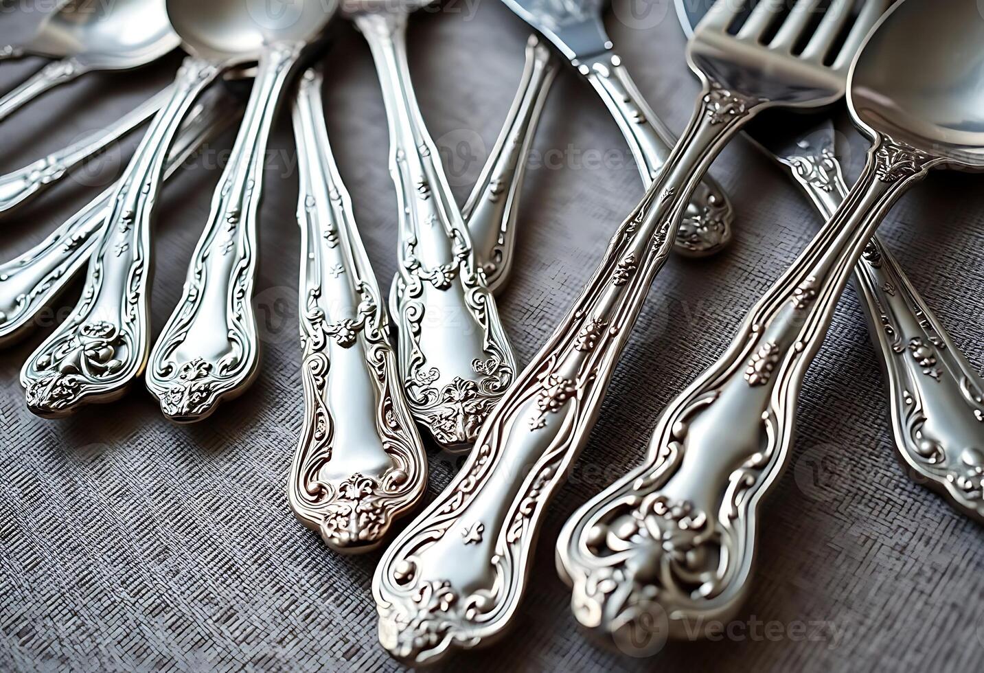 bunch of silverware sitting on top of a table photo